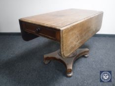 A 19th century mahogany flap-sided pedestal dining table fitted a drawer