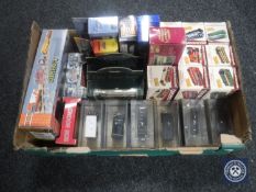 A box containing a quantity of boxed die cast buses including Great British buses etc together with