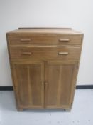 A 20th century linen cabinet