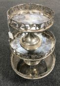 A set of three graduated silver plated cake stands with leaf and grape decoration