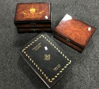 Two contemporary walnut trinket boxes together with a storage box in the form of a book