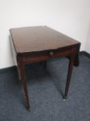 A Victorian mahogany flap-sided table fitted a drawer