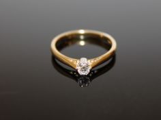 An 18ct gold diamond solitaire ring, size N, approximately 0.2ct.