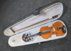 A cased student violin and bow
