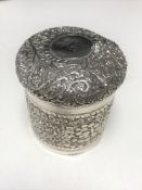 An Indian silver lidded pot,