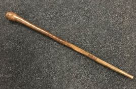 A tribal club walking cane or staff