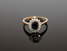 A 9ct gold sapphire and diamond cluster ring, size N 1/2, approximately 0.25ct.