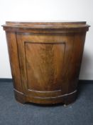 A late nineteenth century continental mahogany corner cabinet