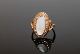 A 9ct gold oval mother of pearl ring, size N 1/2.