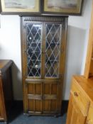 An oak leaded glass door cabinet
