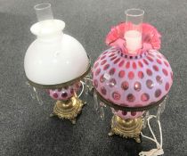 A pair of brass and glass light fittings with cut glass drops,