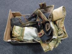 A box containing seven tapestry wall hangings