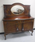 An early 20th century mahogany Queen Anne style sideboard