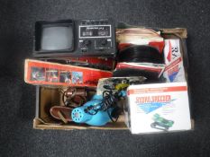 A box containing a Plustron TVR5, quantity of 7" singles, desk lamp,