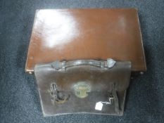 A vintage leather luggage case and a satchel