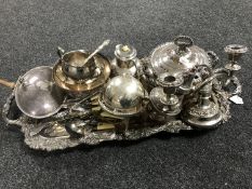 A silver plated twin-handled serving tray containing a quantity of silver plated ware including