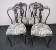 A set of four Victorian dining chairs on cabriole legs