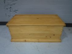 A stripped pine blanket box