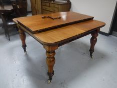 A Victorian mahogany windout dining table with leaf