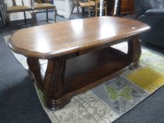 A large oak two-tier coffee table fitted a drawer