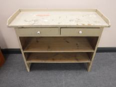 An early twentieth century painted side table fitted with two drawers