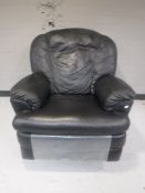 A black leather manual reclining armchair