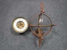 A cast iron sun dial together with a clock movement