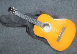 A Messina classical style acoustic guitar in carry bag