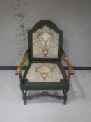 An early 20th century continental armchair upholstered in a tapestry fabric