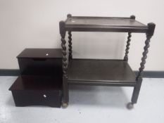 An oak barley twist two tier serving trolley together with a set of storage steps