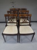 A set of six inlaid mahogany Regency style dining chairs
