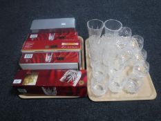 Two trays containing boxed and unboxed Chantilly crystal glasses,