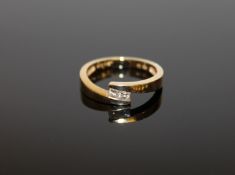An 18ct gold diamond twist set ring, size M 1/2, approximately 0.2ct.