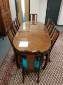 A 20th century Chinese extending dining room table, with two leaves,