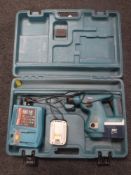 A Makita 24V electric drill with batteries and charger