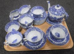 A tray containing twenty-six pieces of Spode blue and white tea china