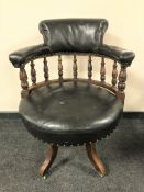 A Victorian swivel captain's chair, with leather upholstery.
