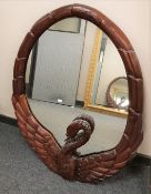 A contemporary carved hardwood 'Swan' mirror, height 101 cm.