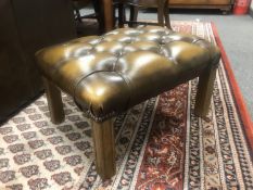 A Chesterfield style buttoned tan leather footstool, width 56 cm.