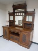 An impressive Victorian mahogany inverted breakfront mirror back sideboard with carved panel doors