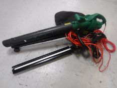 A Gardenline garden vacuum together with a Qualcast electric hedge trimmer