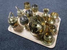 A tray containing assorted brass ware including miniature teapots on trivets, goblets,