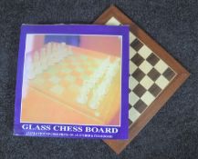A boxed glass chess set together with an Agedrez chess set with wooden board