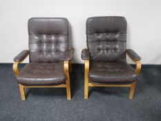 A pair of late 20th century beech framed brown leather upholstered armchairs