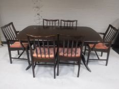 A Stag Minstrel extending dining with a set of six chairs