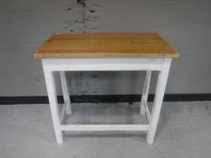 An oak topped side table on painted base