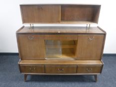 A mid 20th century teak sideboard