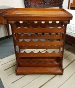 A contemporary wine rack with lift-off drinks tray, width 80 cm.