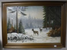 A gilt framed continental school oil on canvas, deer in winter landscape,