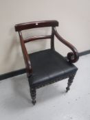 A 19th century stained scroll arm armchair